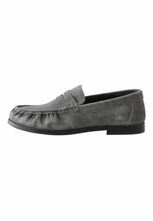 Gray suede men's loafer with moccasin stitching, flat sole, and penny strap detail shown from the side on a white background.