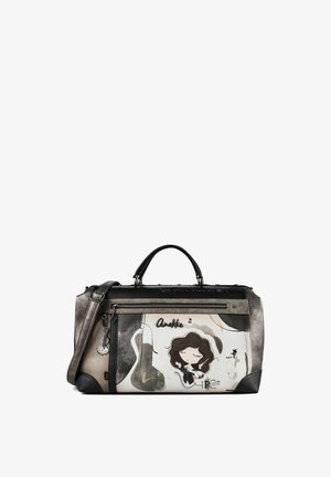 Sac à main noir et gris avec une fille dessin animé aux yeux fermés, une guitare et un chat comme partie du design artistique sur le panneau avant.