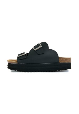 Black open-toe sandal with two adjustable silver buckles and a thick cork and black rubber sole, side view on white background.