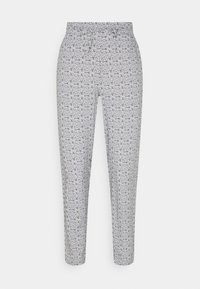 Tištěné kalhoty s celoplošným černobílým květinovým vzorem, zúženým střihem, hladkou texturou a elastickým pasem.