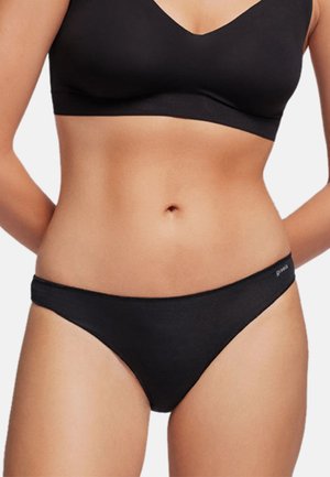 Culotte de bikini en coton noir au design minimal, avec une coupe taille basse et un détail de logo sur la ceinture. Texture lisse.