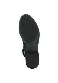 Black shoe sole with a smooth surface, rounded toe, and a low heel. It features ribbed traction for grip and durability.