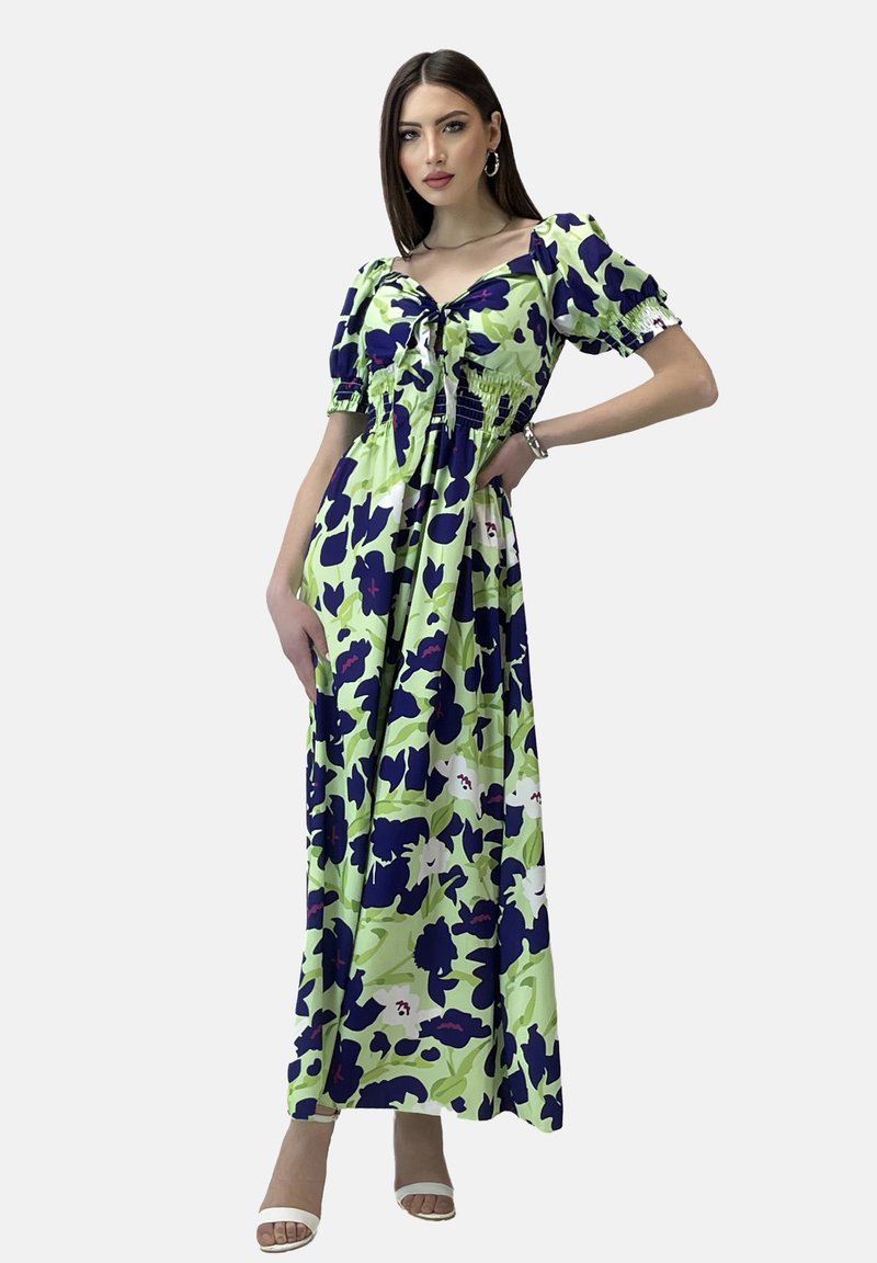 Maxi-Kleid in Grün mit lila Blumenmuster, featuring Puffärmel, einem Kordelzug vorne und einer lockeren, fließenden Silhouette.