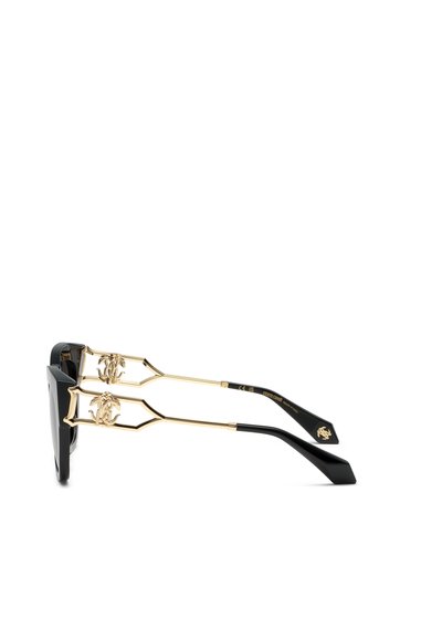 Lunettes de soleil noires et dorées avec des branches fines en or comportant des logos décoratifs dorés près des charnières et des embouts noirs.