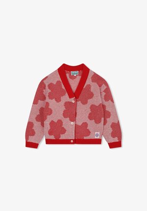 Rode gebreide cardigan met een witte en rode bloemenpatroon, sjaalkraag, knoopsluiting en ribgebreide manchetten en zoom. Label zichtbaar rechts onderaan.
