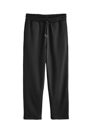 Black sweatpants made of soft fabric, featuring an elastic waistband, drawstring, and side pockets. Smooth texture, tapered legs.