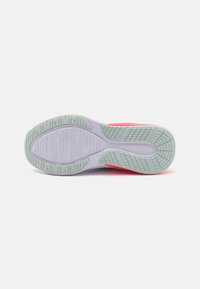 Shoe sole in light grey and pink with textured grip pattern. Features rounded shape and reinforced heel for durability.