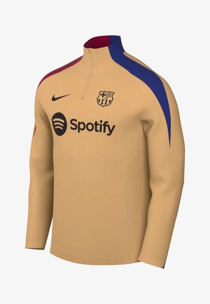 Pullover sportivo marrone con colletto a zip a un quarto. Presenta accenti blu e bordeaux sulle spalle. Mostra il logo del club e il branding di Spotify.