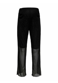 Czarne spodnie z fakturowaną górą ozdobioną rozsypanymi kryształkami oraz przezroczystymi dolnymi panelami tworzącymi zwiewny kontrast. Projekt z elastyczną talią.