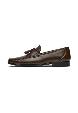 Dark brown leather tassel loafer with stitched details and low black heel, shown in side profile on white background.