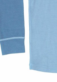 Two pieces of fabric in varying shades of blue are shown. Both have a smooth texture, with contrasting stitching along the edges.