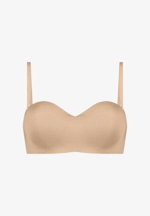 Beige strapless bra with smooth, molded cups and thin straps. Features a subtle sheen and a rounded shape for comfort and support.