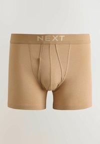 Beigenväriset miesten boxer-lahkeet, joissa on tukeva etutasku ja leveä elastinen vyötärönauha, jossa lukee "NEXT" vaaleanbeigeillä kirjaimilla.