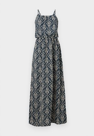 Robe longue sans manches bleu marine et blanche avec une taille cintrée et un motif complexe en forme de feuilles sur tout le tissu.