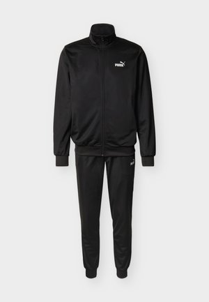 Survêtement noir en tissu lisse, comprenant une veste zippée à col montant et un pantalon ajusté assorti, tous deux ornés d'accents du logo Puma blanc.