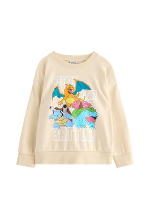 Beige sweatshirt med farverige Charizard, Blastoise og Venusaur samt teksten "Klar til kamp!" på forsiden.