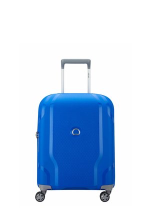 Blue hardshell suitcase with a textured surface, retractable gray handle, and four black wheels. Notable logo at the center top.