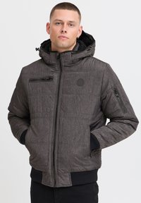 Warm, gray, fully-zippered jacket with a hood. Features side pockets, textured fabric, and ribbed cuffs. Includes a small zippered chest pocket.