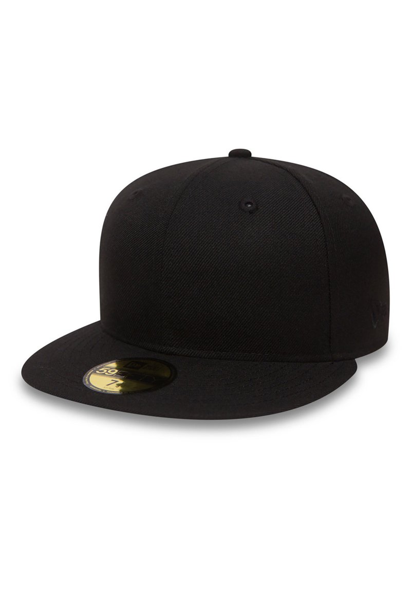 Black cap made of fabric with a flat brim. Features a textured surface, ventilation holes, and a round sticker on the brim.