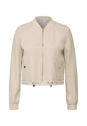 Beige cropped Bomberjacke mit einem Frontreißverschluss, elastischen Bündchen, Seitentaschen und Kordeln an der Taille für eine verstellbare Passform.