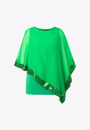 Poncho transparente verde brillante con dobladillo asimétrico y ribete de lentejuelas sobre top verde sólido con escote redondo.