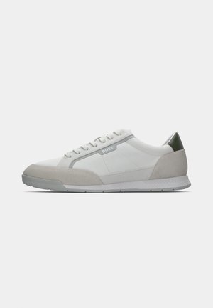 White and gray low-top sneaker with lace-up front, suede toe cap, green heel accent, and "BOSS" branding on the side.
