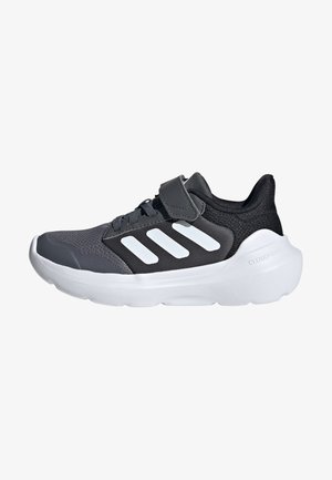 Black and gray athletic shoes with a mesh upper, three white accent stripes, and a padded ankle. Features a thick white rubber sole.
