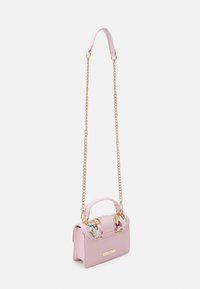 Pink handbag with a floral top panel, leather material, gold-tone chain strap, and a rounded handle for easy carrying.