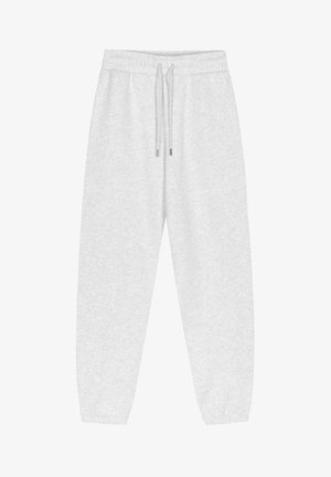 Pantaloni della tuta grigio chiaro realizzati in tessuto morbido, con vita elastica e cordoncini, fondo gamba a sigaretta e senza motivi visibili.