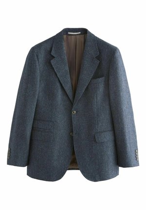 Mørkeblå blazer lavet af tekstureret uld, med to forlommer, en enkelt brystlomme og en glat brun foring. To-knaps lukning.