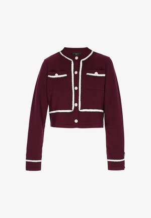 Cárdigan corto burdeos con ribete blanco, dos bolsillos de parche y botones perlados. Tejido suave con mangas largas y puños acanalados.