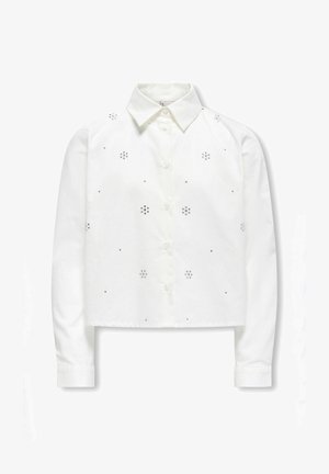 Bijela skraćena košulja dugih rukava, rebrasti manžeti, dugme sprijeda, i dekorativni srebrni zakovi u cvjetnim uzorcima.