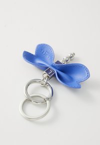 Blue leather butterfly keychain with silver hardware, featuring two rings and a decorative bead. Smooth texture with detailed stitching.