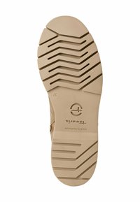 Tan rubber shoe sole with a textured zigzag pattern for grip. Includes brand logo "Tomar" and text "Made in Portugal."
