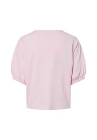 Vaaleanpunainen puuvillapaita, jossa on lyhyet, puffimaiset hihat ja rento leikkaus. Saumayksityiskohdat ja elastiset hihansuut lisäävät tekstuuria muotoiluun.