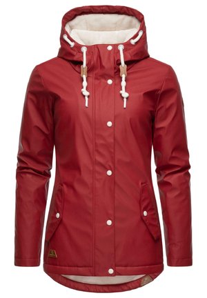 Red waterproof jacket with a soft beige lined hood, adjustable drawstrings, white buttons, and two side pockets. Smooth, shiny texture.