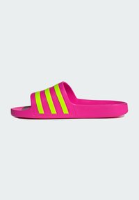 Pink slide sandal with three vertical neon green stripes. Made of a smooth, textured material with a contoured footbed. Flat sole.