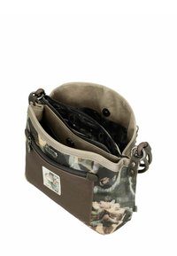 Meergekleurde handtas met een bloemmotief, bruine leren accenten, twee binnenvakken, bovenste ritssluiting en verstelbare schouderriem.