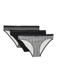 Trois culottes pour femmes : une noire à pois, une noire unie, et une noire avec un motif floral blanc, toutes dotées de ceintures élastiques douces.