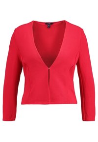 Červená zip-up bunda s hlubokým výstřihem do V, dlouhými rukávy, žebrovanou texturou a přiléhavým střihem, s centrálním zipovým uzávěrem.