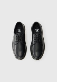 Black leather shoes with a smooth texture, rounded toe, classic lace-up design, and cushioned insoles for comfort.