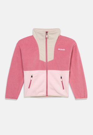 Rózsaszín és krémszínű polárdzseki magas gallérral, elől cipzárral és két cipzáras zsebbel derékmagasságban. A mellrészen Columbia logó.