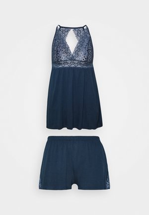 Dark blue two-piece sleep set featuring a lace-trimmed tank top with a keyhole back and matching shorts with lace accents. Soft fabric texture.
