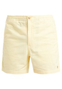 Žluté bavlněné kraťasy s elastickým pasem a předním knoflíkem. Mají texturovaný povrch a malé vyšívané logo na spodní straně.