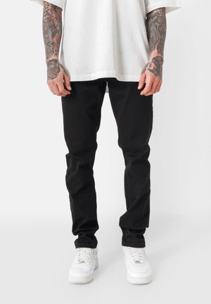 UNIFIED - Jeans a sigaretta - black