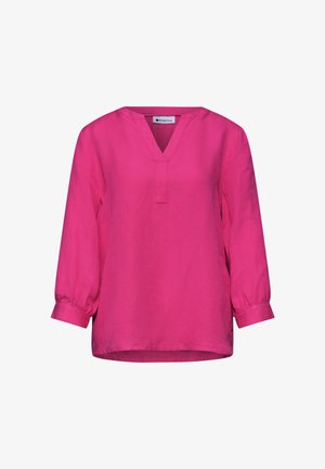 Kirkkaan pinkki pitkähiha pusero, jossa V-kaula-aukko ja mansetit, löysä istuvuus, yksinkertainen muotoilu, valkoisella taustalla esitetty.