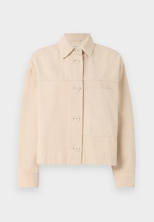 Beige cropped jacket made of durable fabric, featuring a button closure, pointed collar, and a single chest pocket. Smooth texture.
