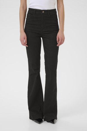 High-waisted black flared jeans with a smooth texture, button closure, and five-pocket design, featuring a fit that flares from the knee down.