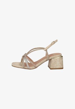 Sandalo beige open-toe con tacco a blocco, sottili cinturini annodati, cinturino regolabile alla caviglia con fibbia dorata e dettagli sottilmente scintillanti.