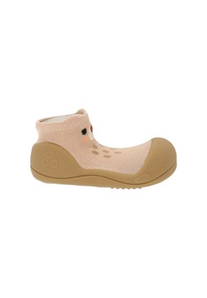 Scarpa beige per bambino con suola in gomma morbida e puntale, tomaia a maglia con piccolo volto ricamato e dettagli colorati sul lato.